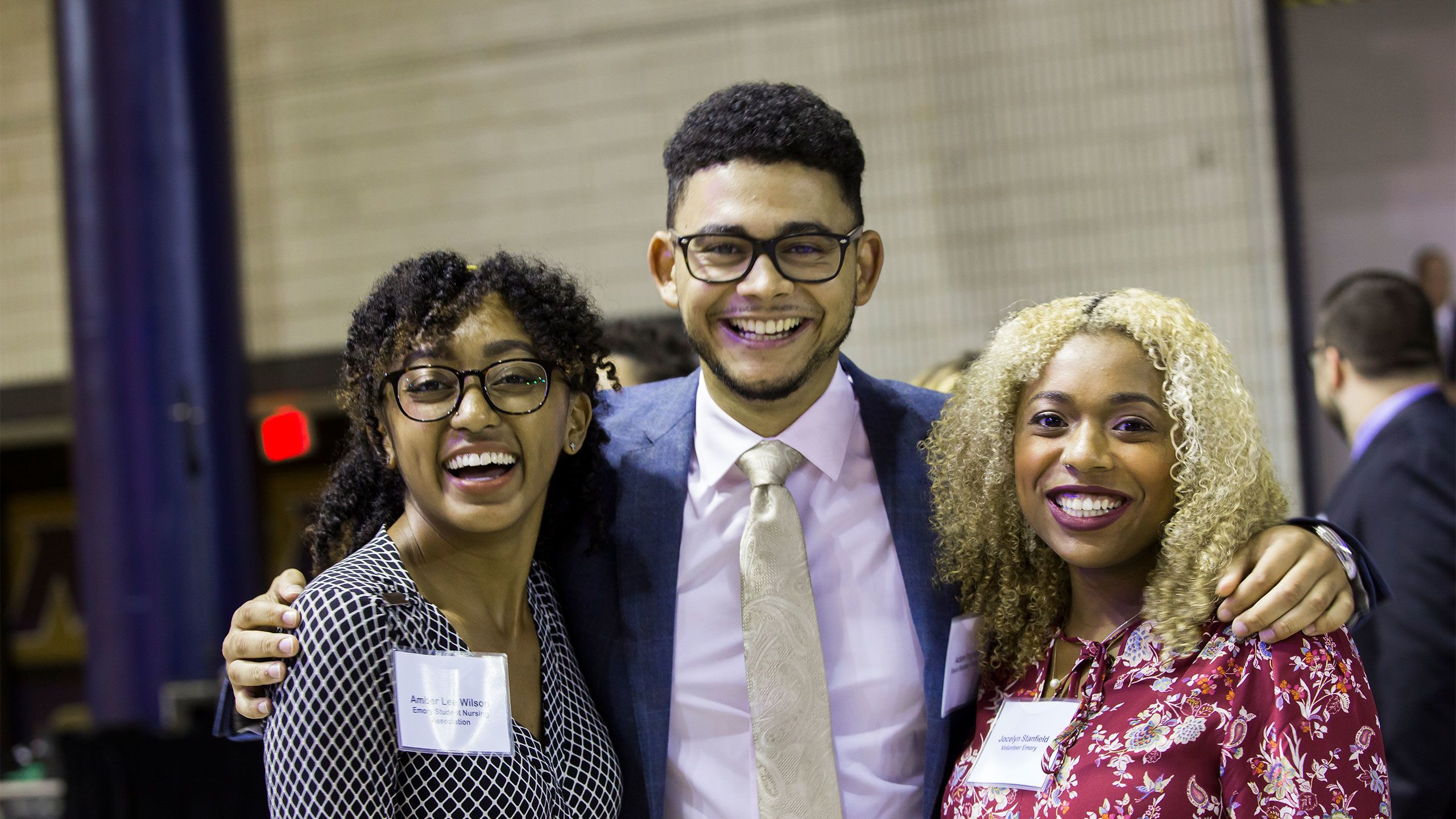 Three students pose for a photo after the event