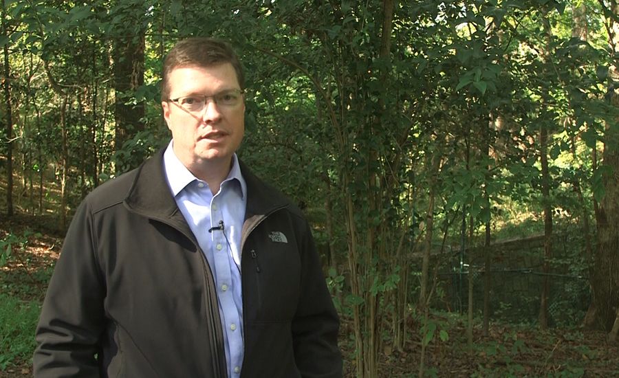 A video still of Marshall Lyon in the woods.
