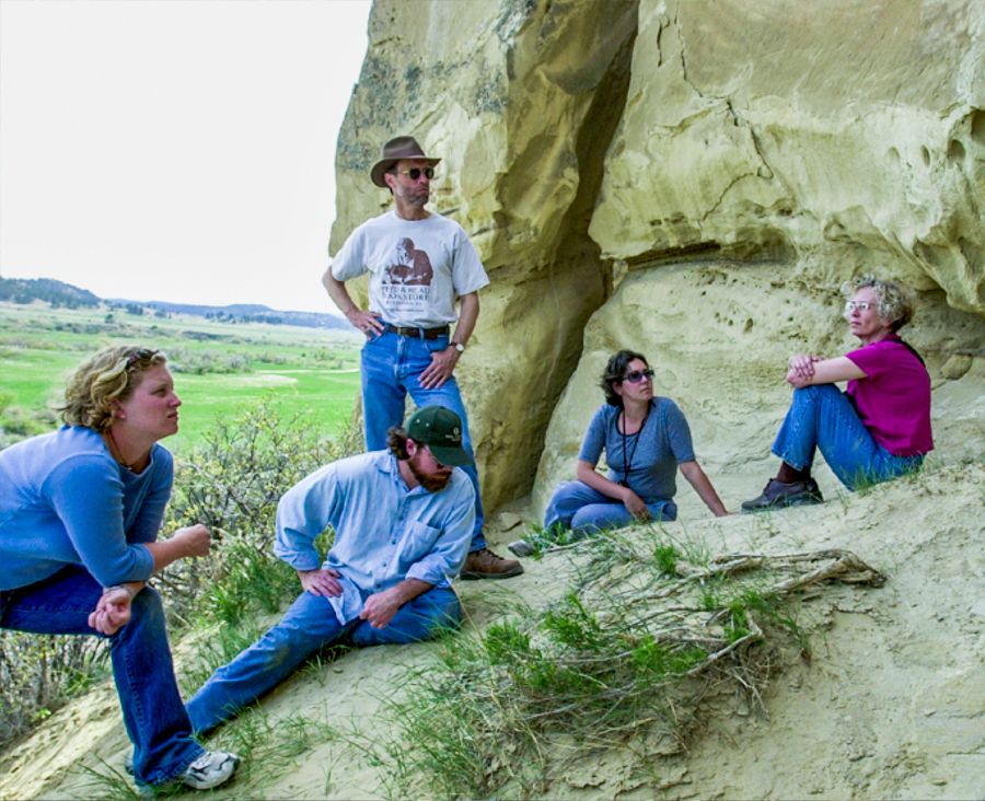 Hauk and others by a rock outcropping in Montana