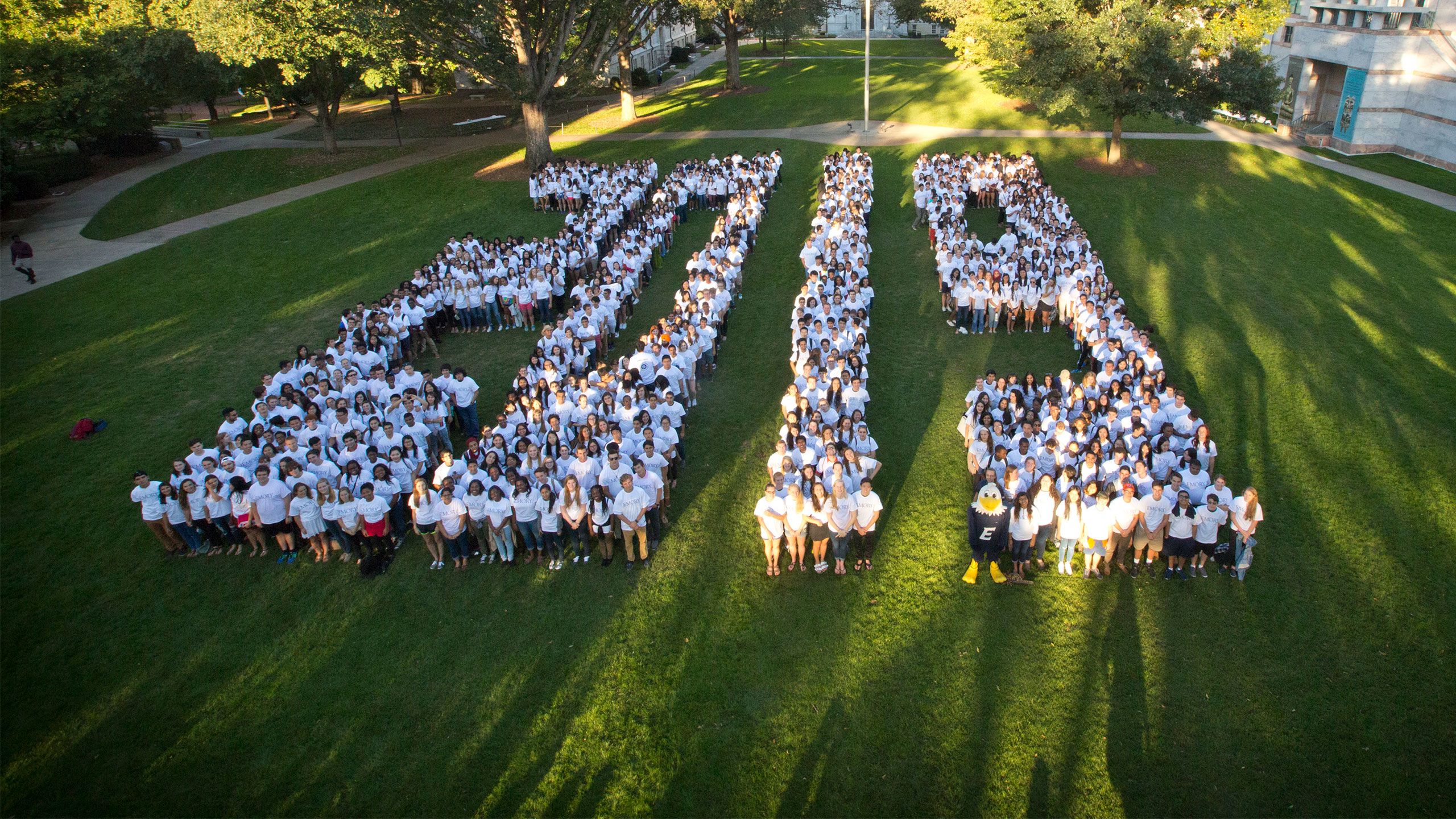 Students in white t-shirts form the number 2019