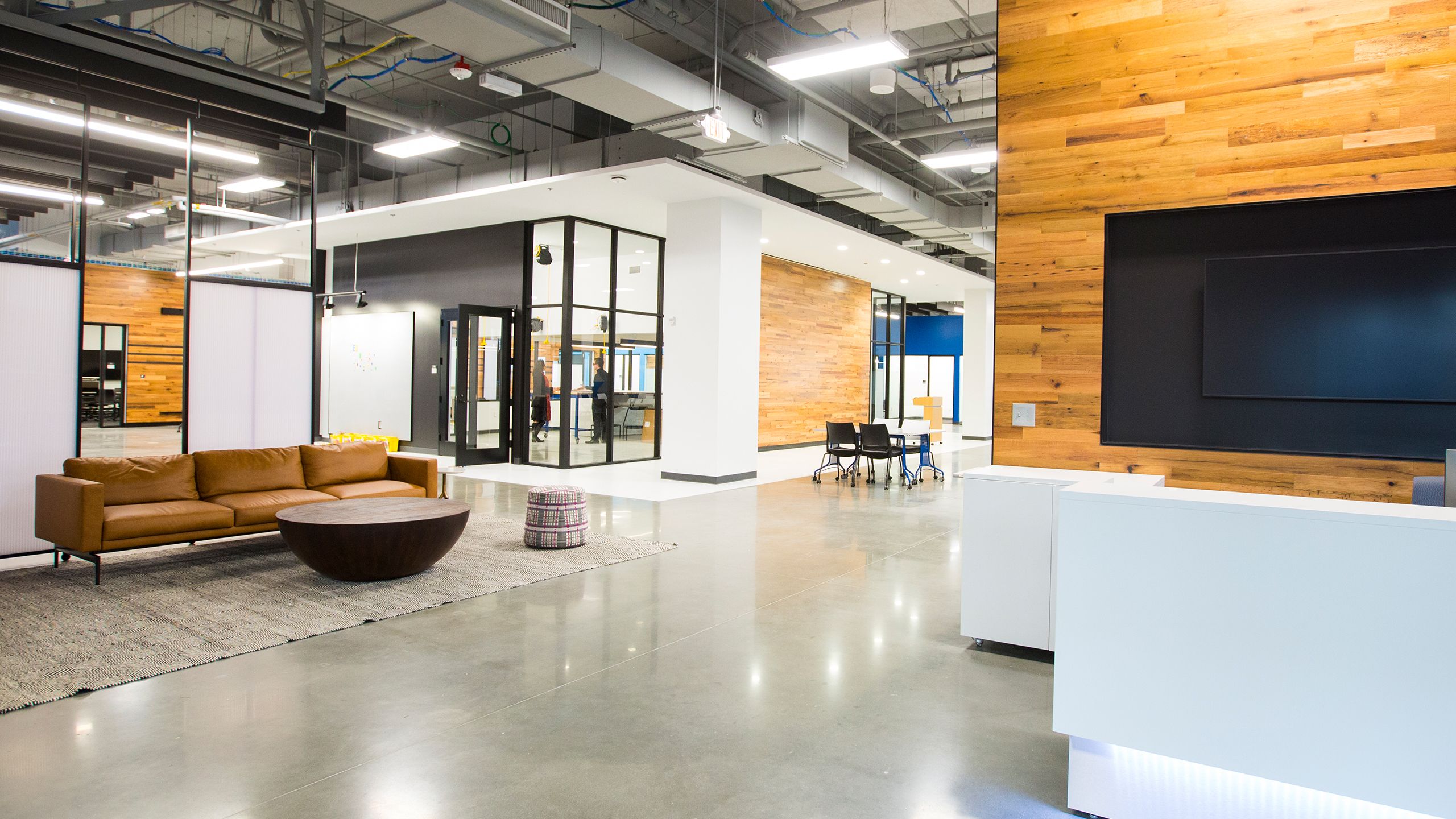 Two people in discussion within a conference room
