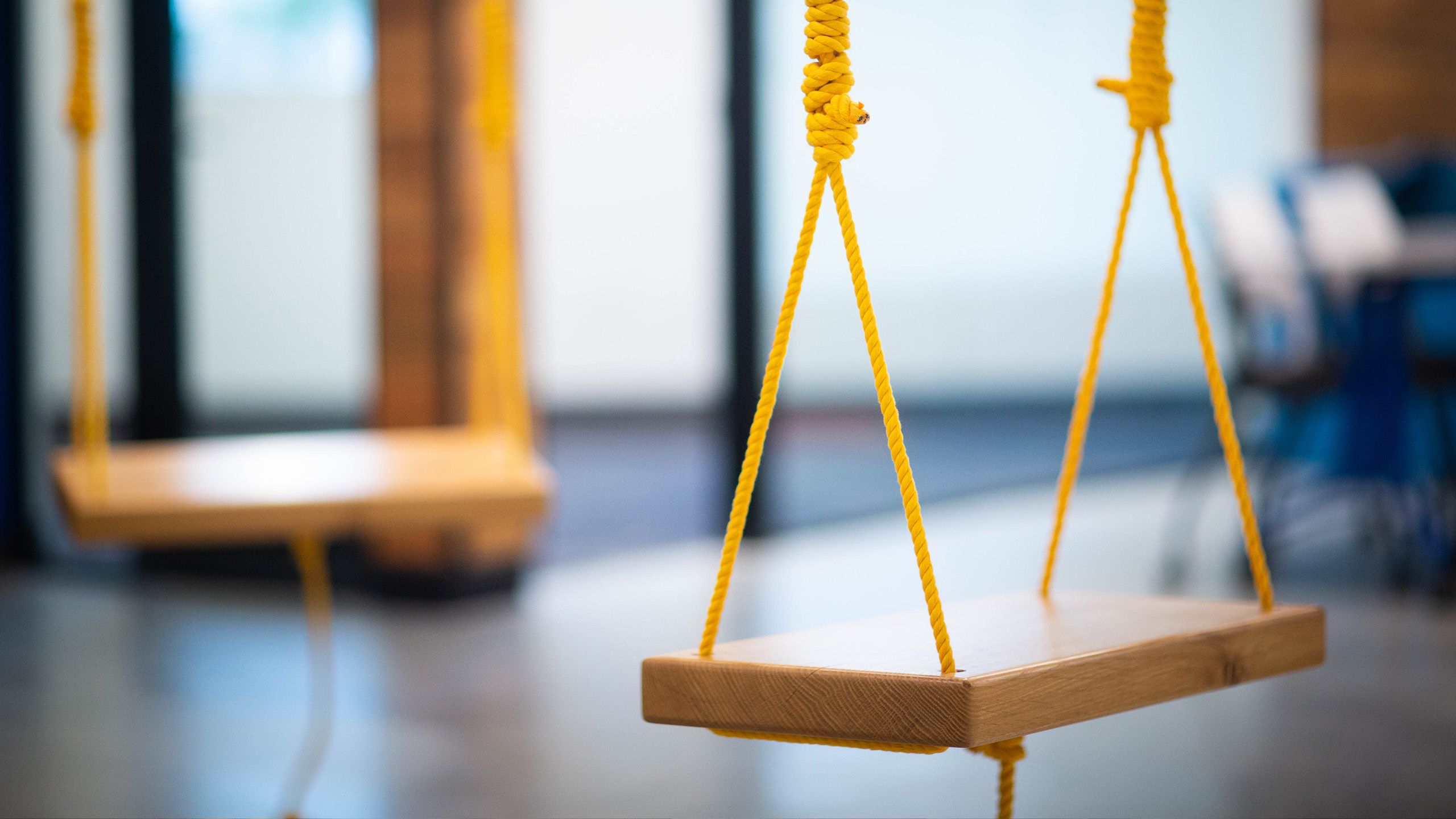 Shot of swings hanging from ceiling