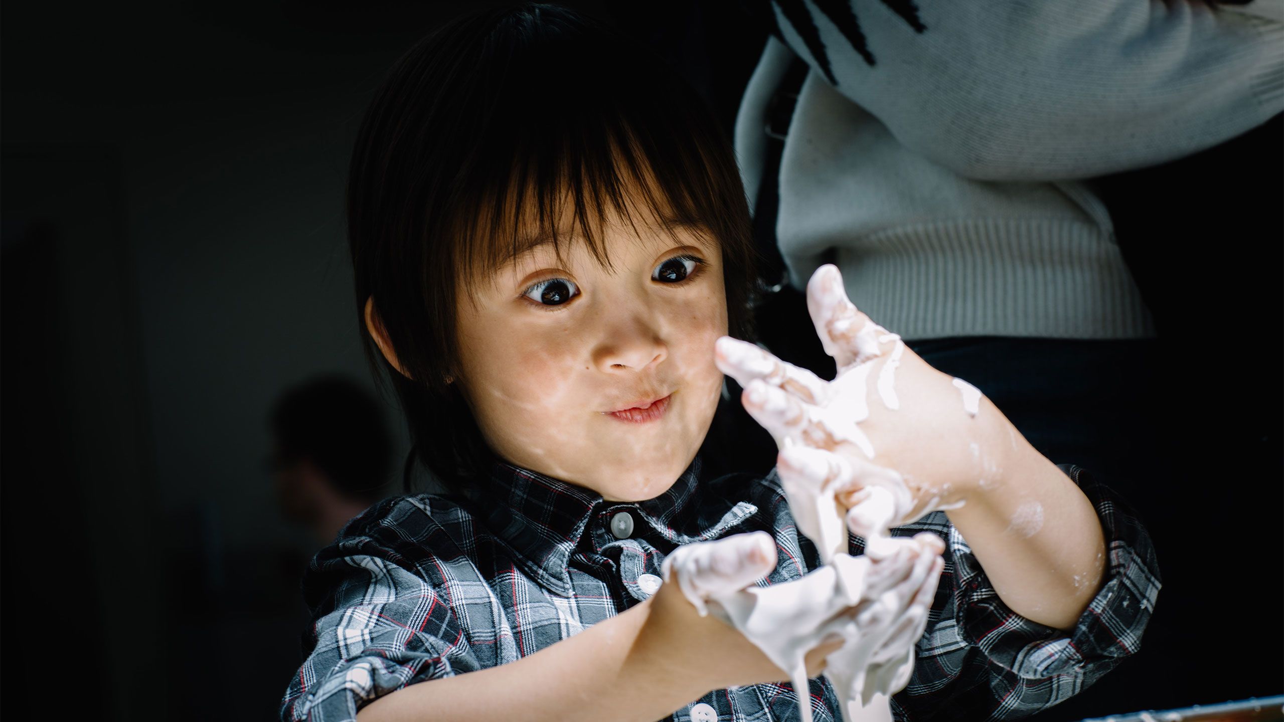 A child plays with slime