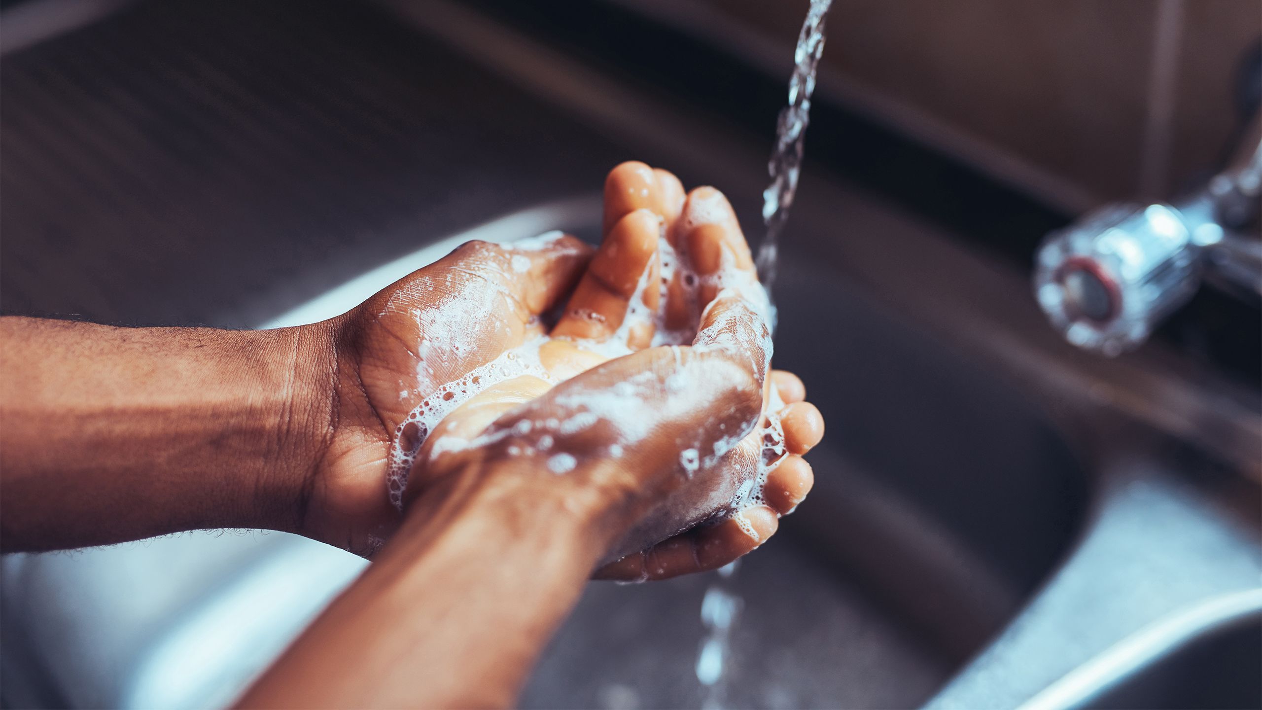A close-up of washing hands with soap