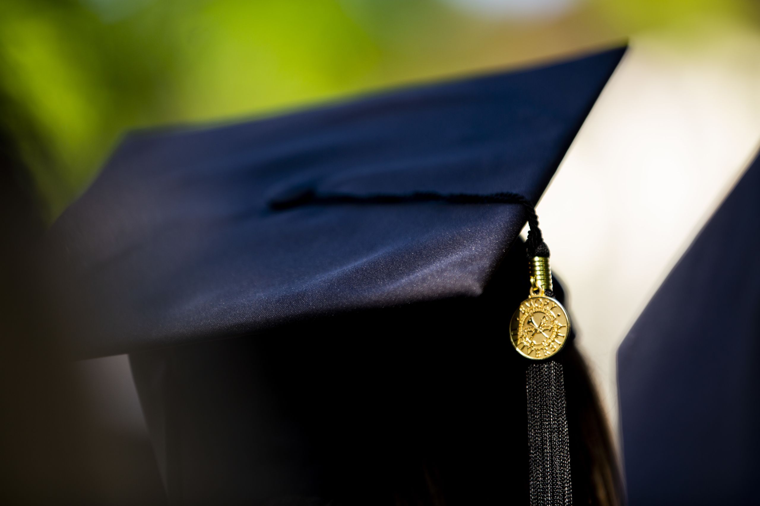 A close-up photo of an Emory graduation cap and tassel