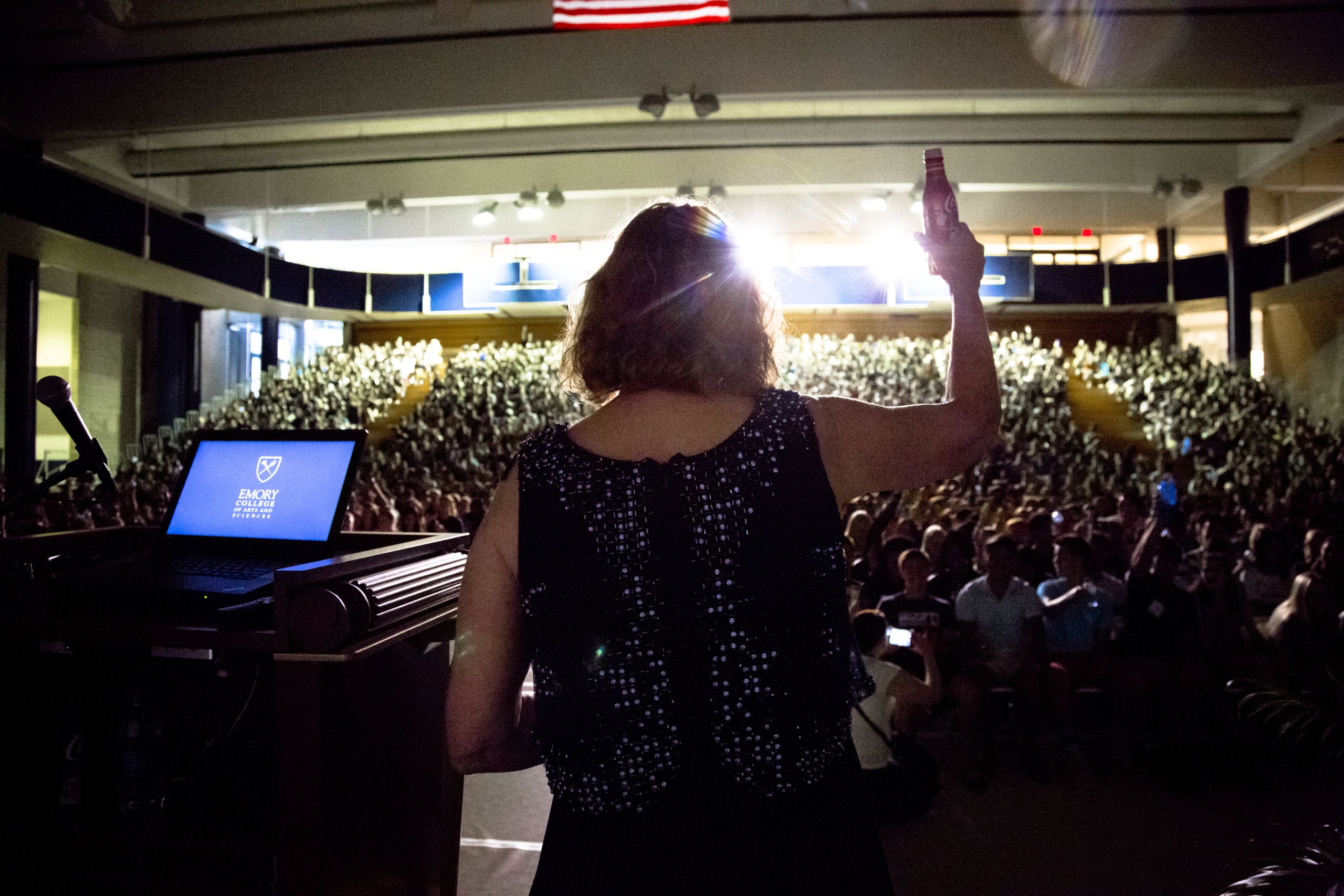 President Sterk holding up a bottle of Coke