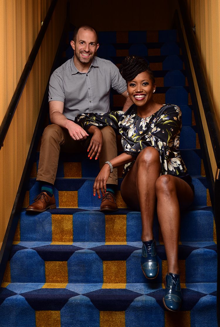 Portrait of Ben Arnon and Erika Alexander sitting on steps.