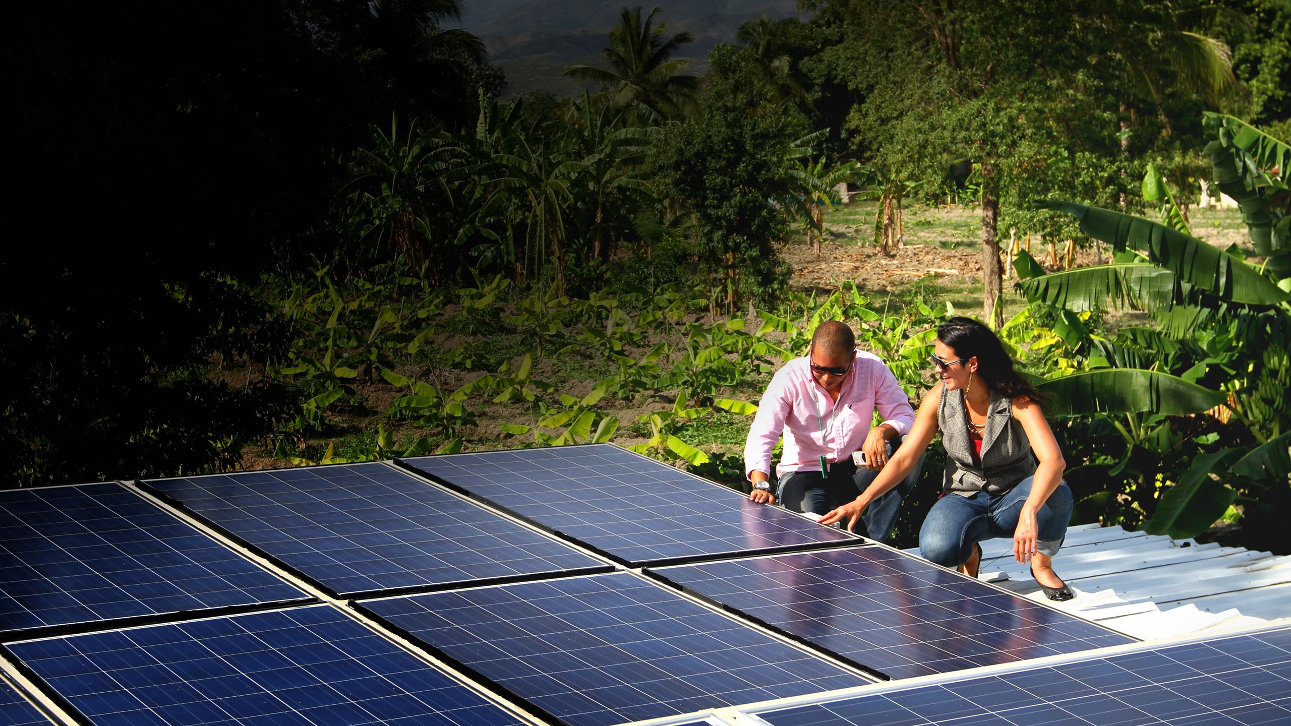 10Power Founder/CEO, Sandra Kwak with Haitian solar partner Fred Brisson at a solar power installation. 