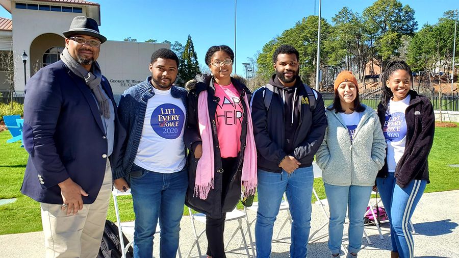 Photo of McDaniels with Emory’s Douglass Day student readers this past February, from left, Timothy Richmond, Zariah Embry, Deen Whitaker, Kassie Sarkar, and Jordan Bates.