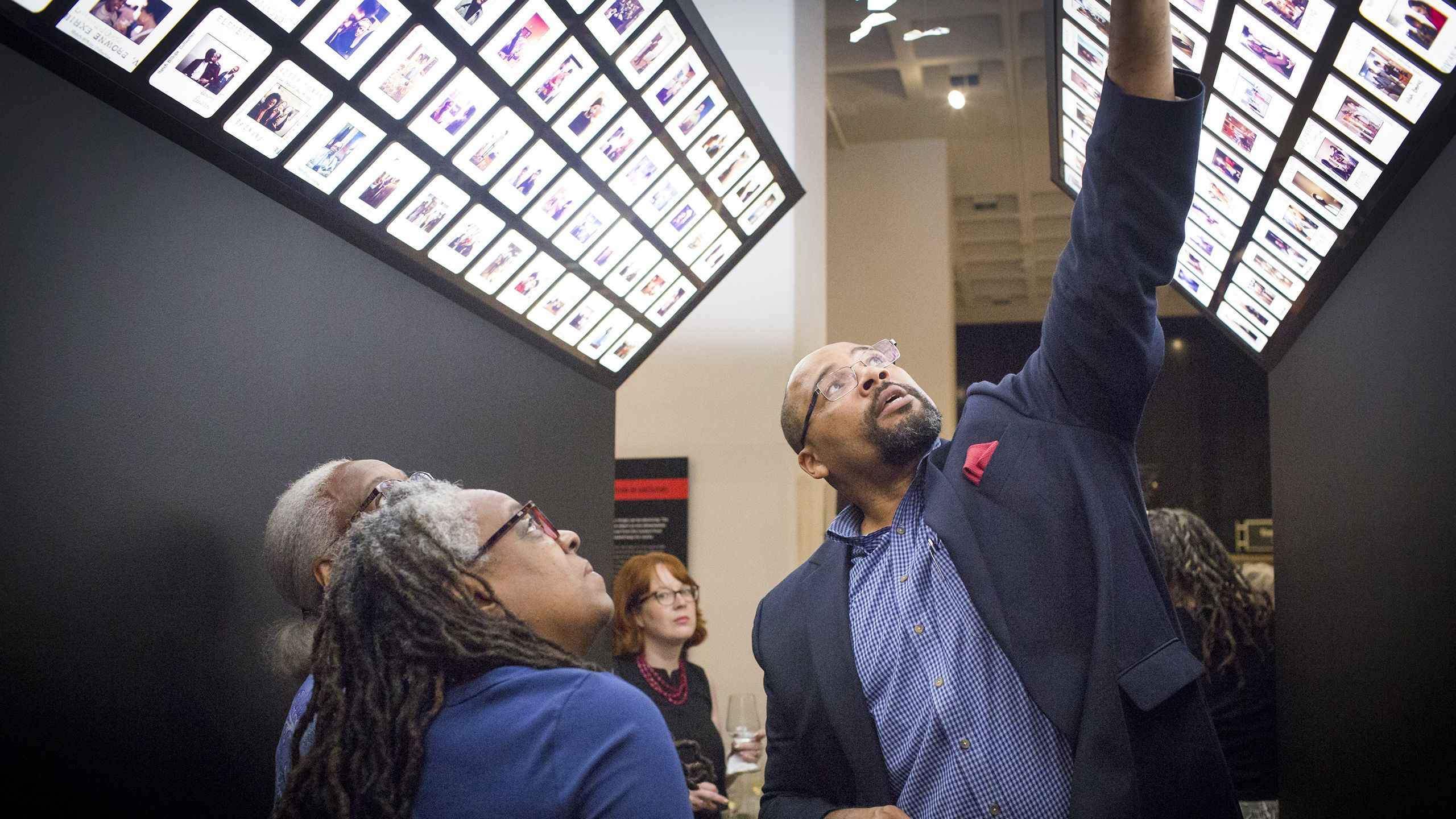 Large photo of Pellom McDaniels at an exhibition.