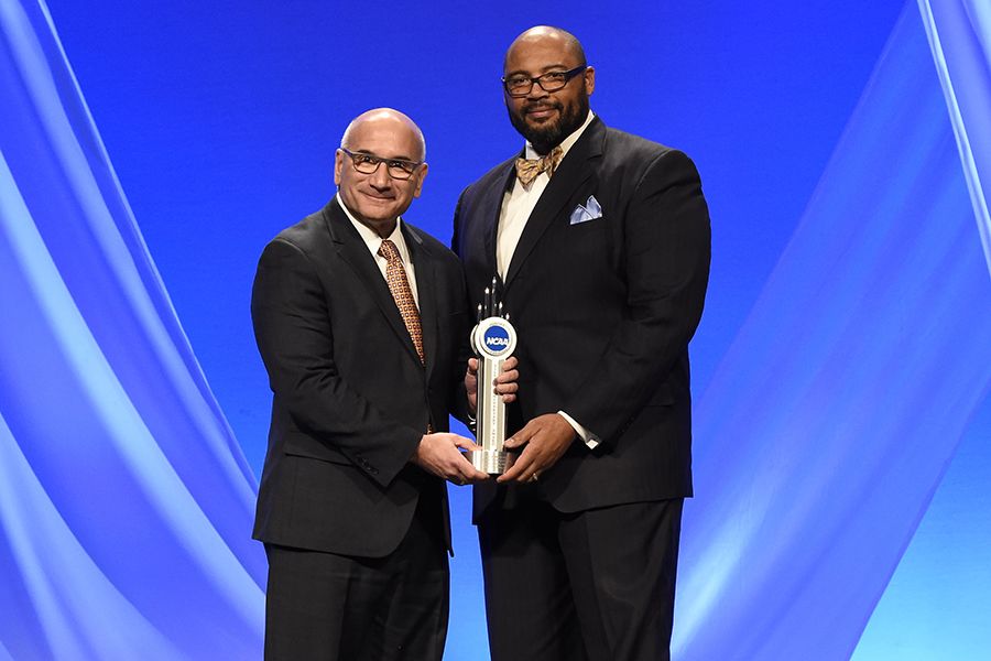 Photo of McDaniels received the 2015 NCAA Silver Anniversary Award, given to former student athletes, from Bob De Carolis, Oregon State athletics director (Photo: Jamie Schwaberow/NCAA).