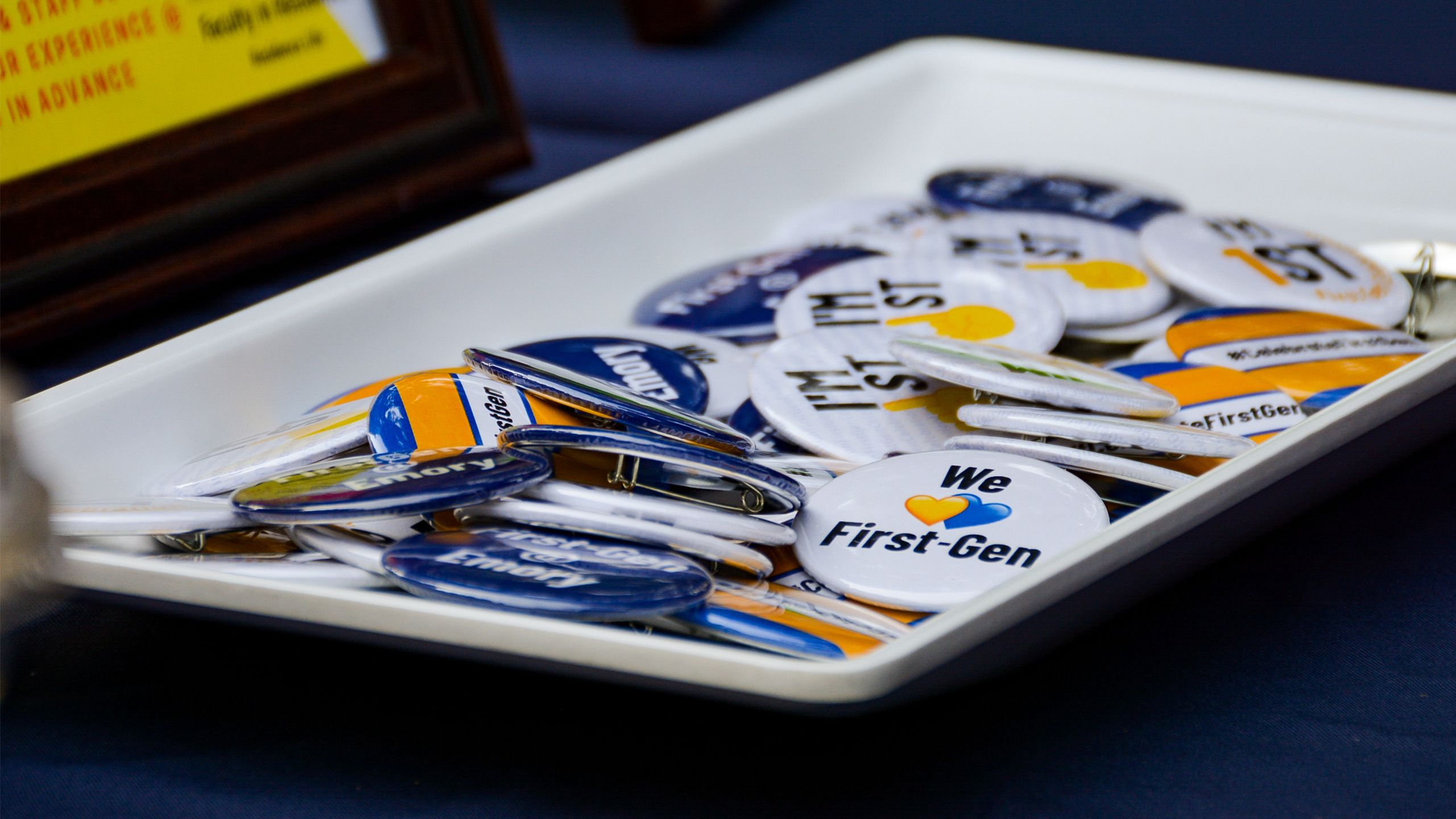 A tray filled with buttons celebrating First-Gen Day at Emory.