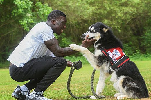 Emory and Grady Burn Center patient Jalen Richardson with his service dog