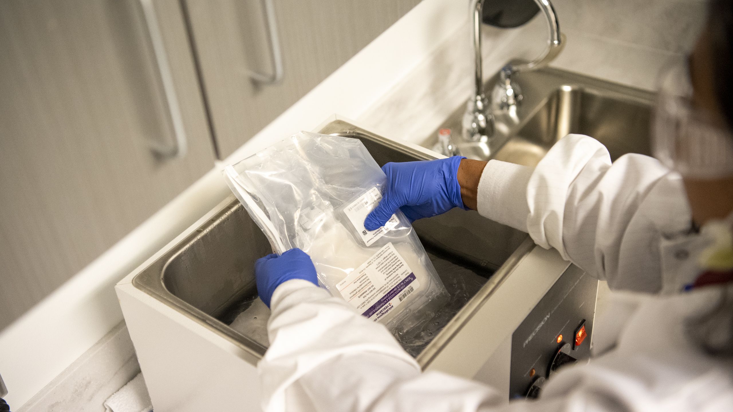 Photo series illustrating the CAR T-cell therapy process