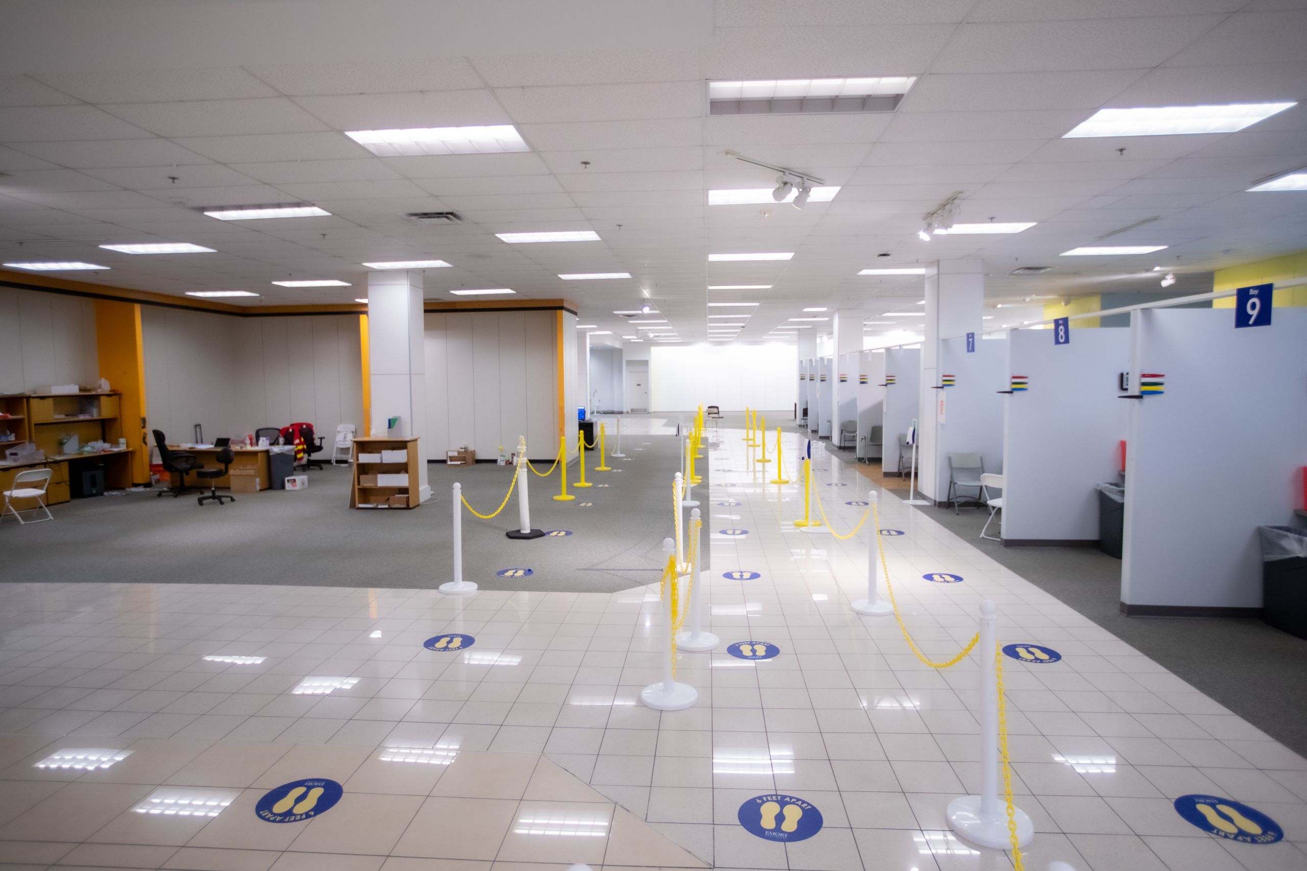 lines are marked to direct people through the vaccine clinic