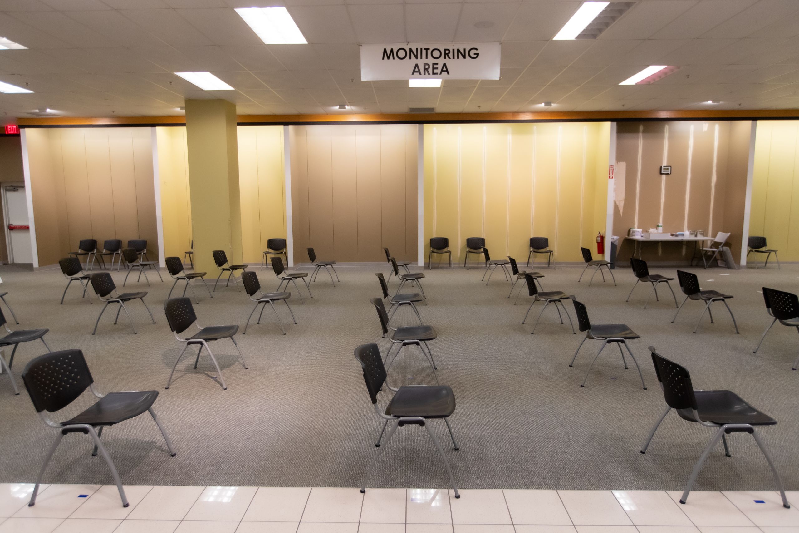 rows of empty, distanced chairs await patients in the waiting area