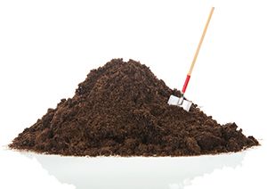 a shovel in a pile of dirt