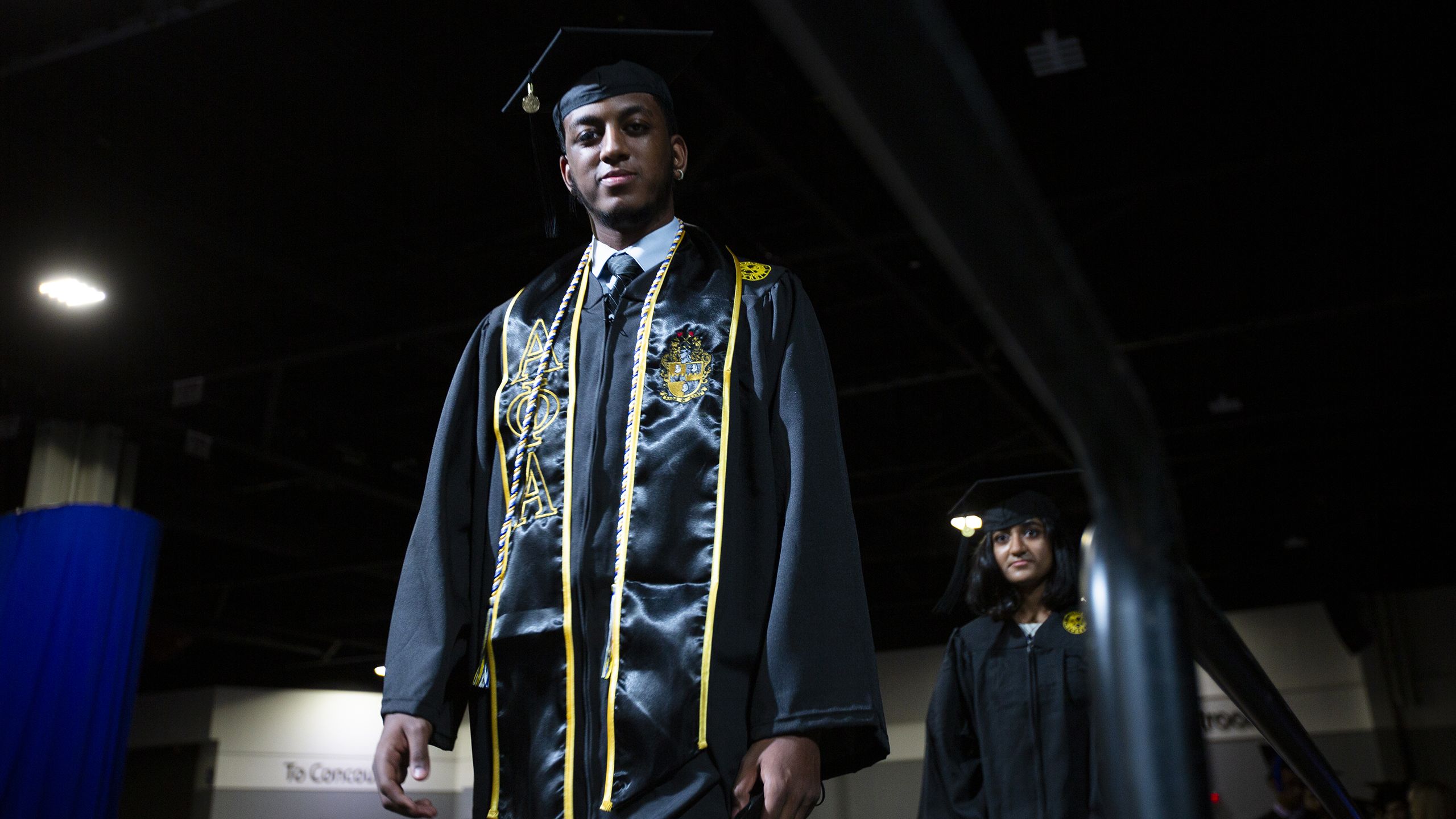 Graduate walking across stage