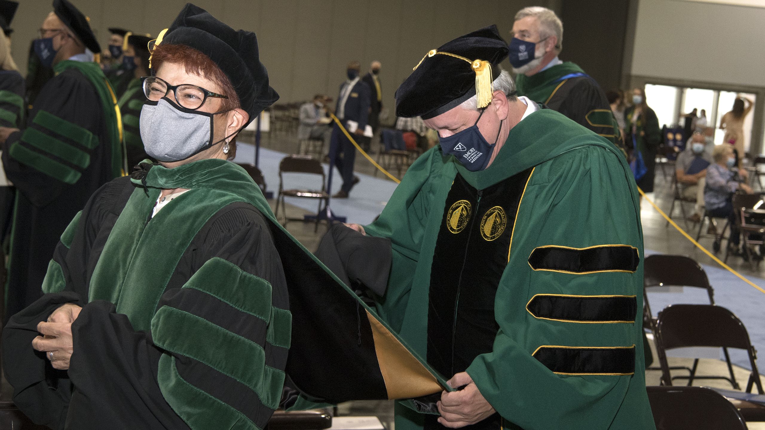 Graduate having hood placed