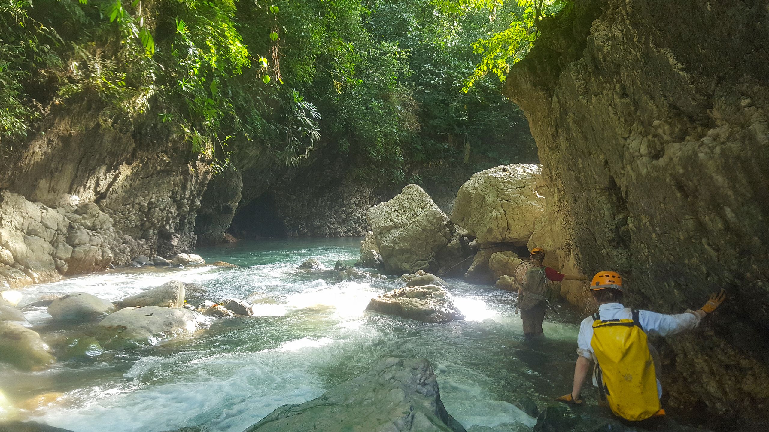 Crossing a river to go to another cave