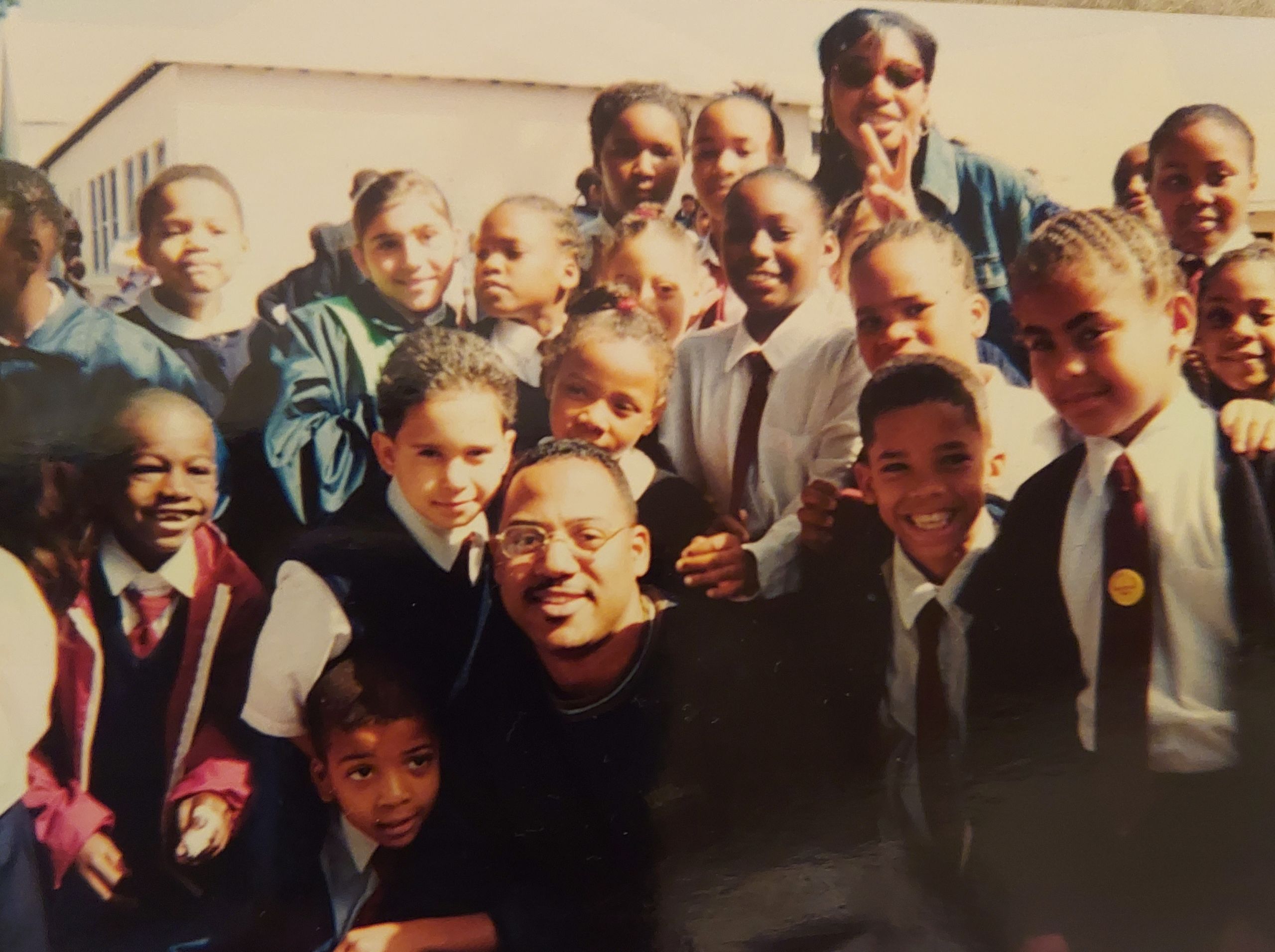 VOIS members pose with children