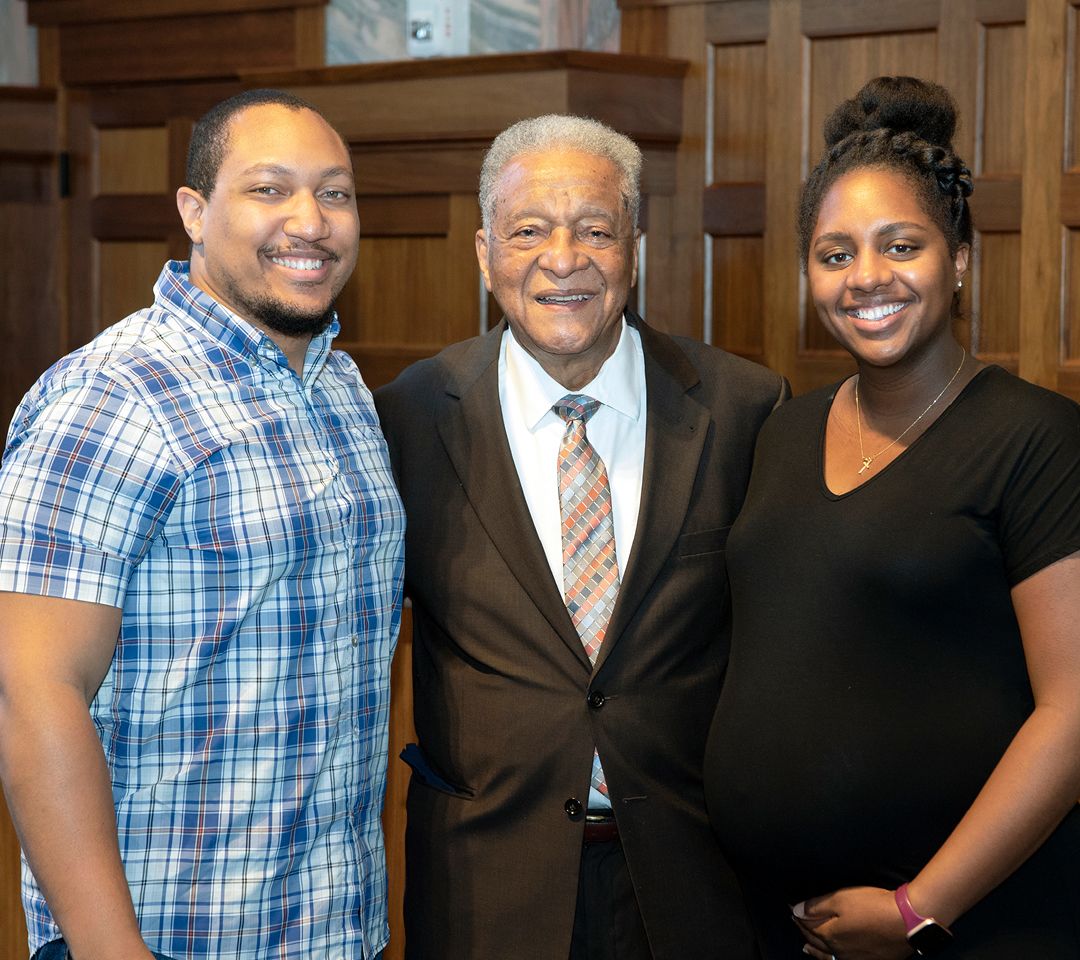 Hood stands with his daughter and son-in-law after the event in Emory's Convocation Hall.