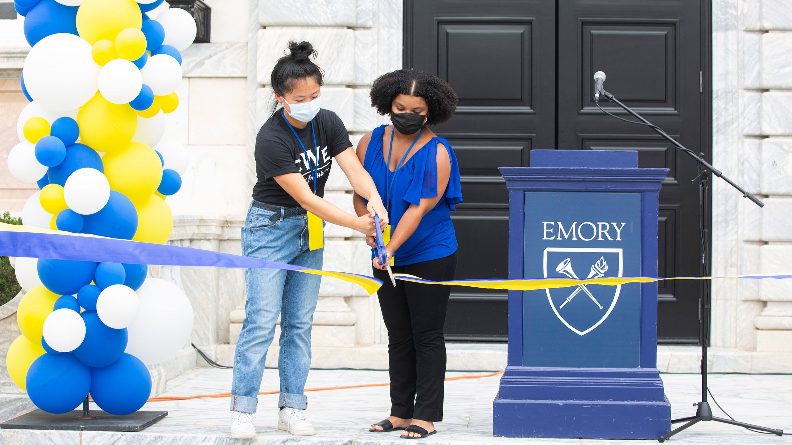 Students cut a ribbon at the identity spaces unveiling