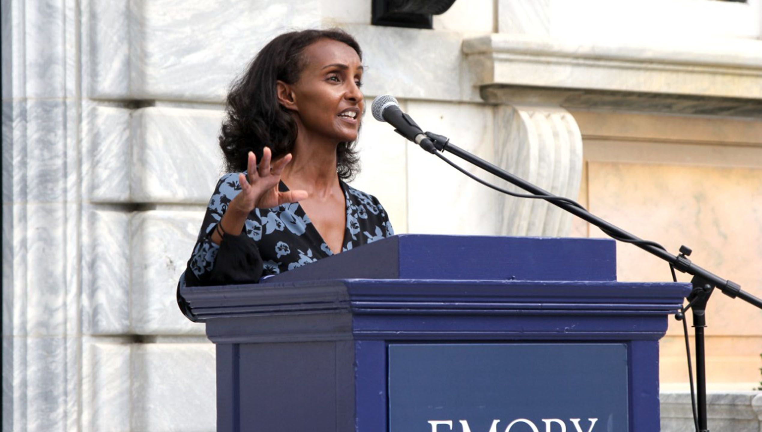 Enku Gelaye speaks at the Identity Spaces ribbon cutting.