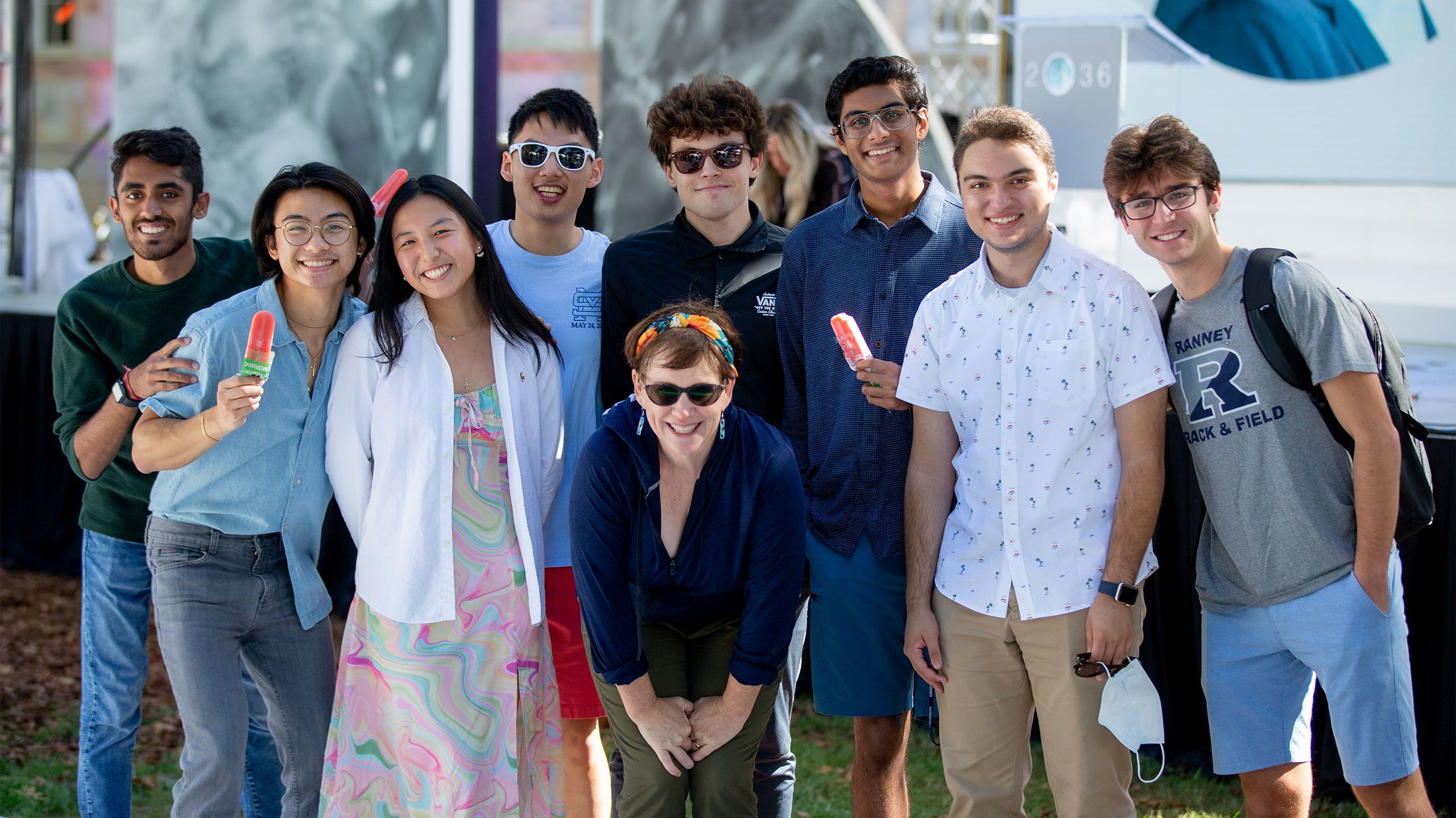 A group of people poses for a photo at the 2O36 event.