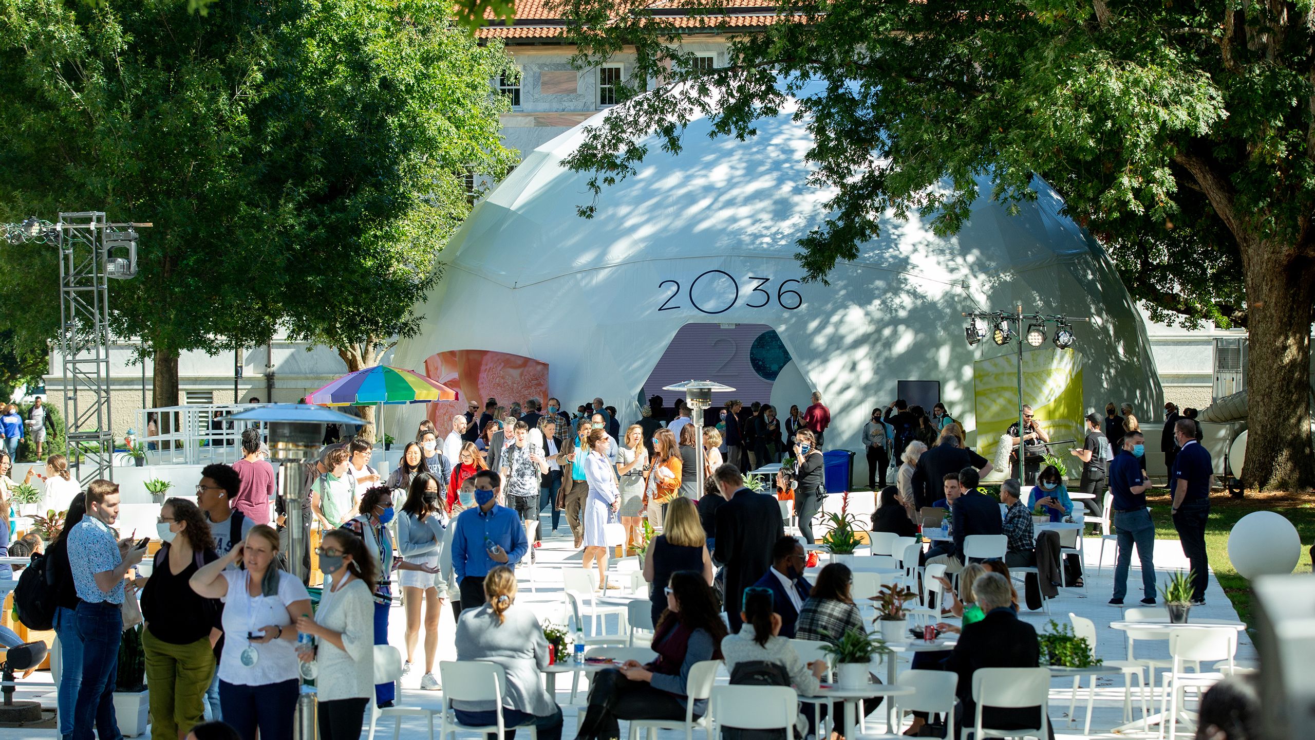 A crowd stands outside a 2O36 dome