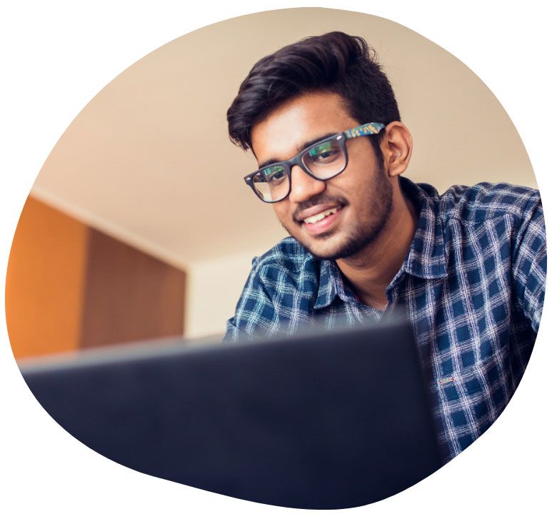 A student looks at a laptop