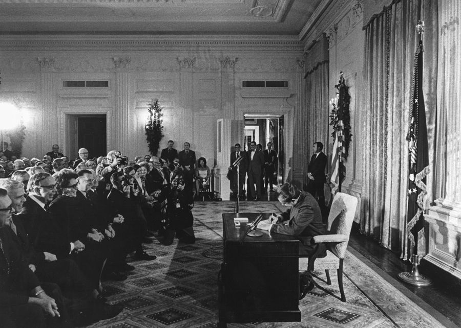 Richard Nixon signing the National Cancer Act in 1971