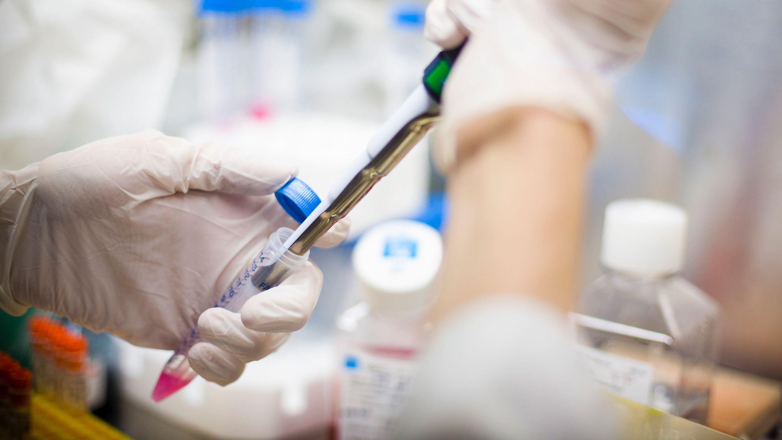 General research laboratory hands holding dropper