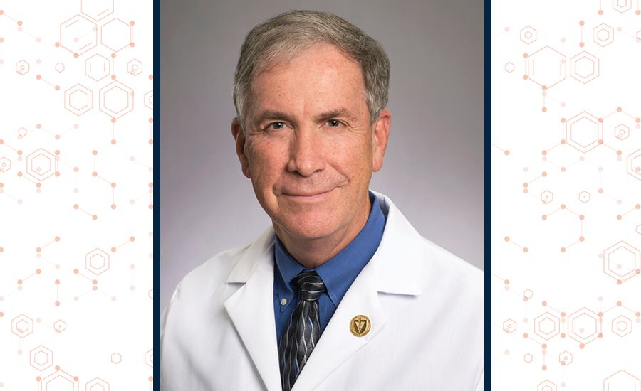 a headshot of david stephens in a white doctor coat.