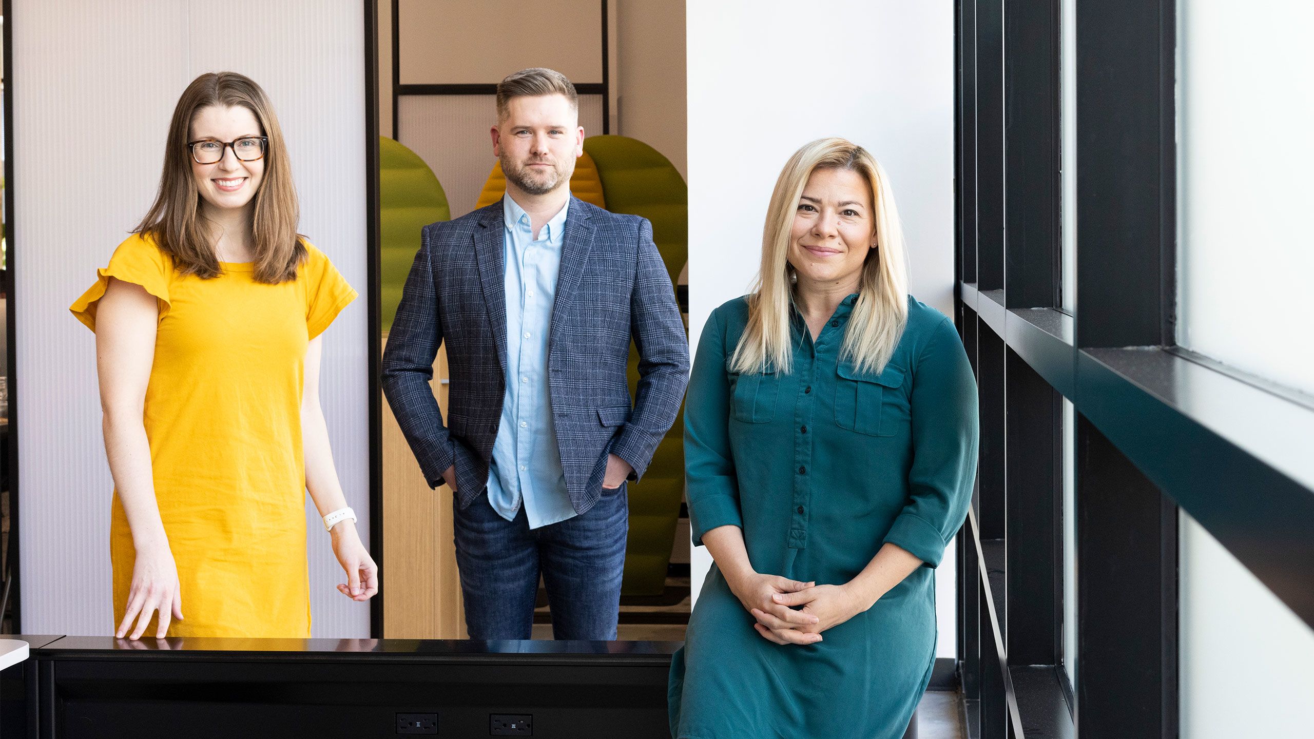A photo of John Gulledge standing with Kelly Duquette and Mary Taylor Mann.
