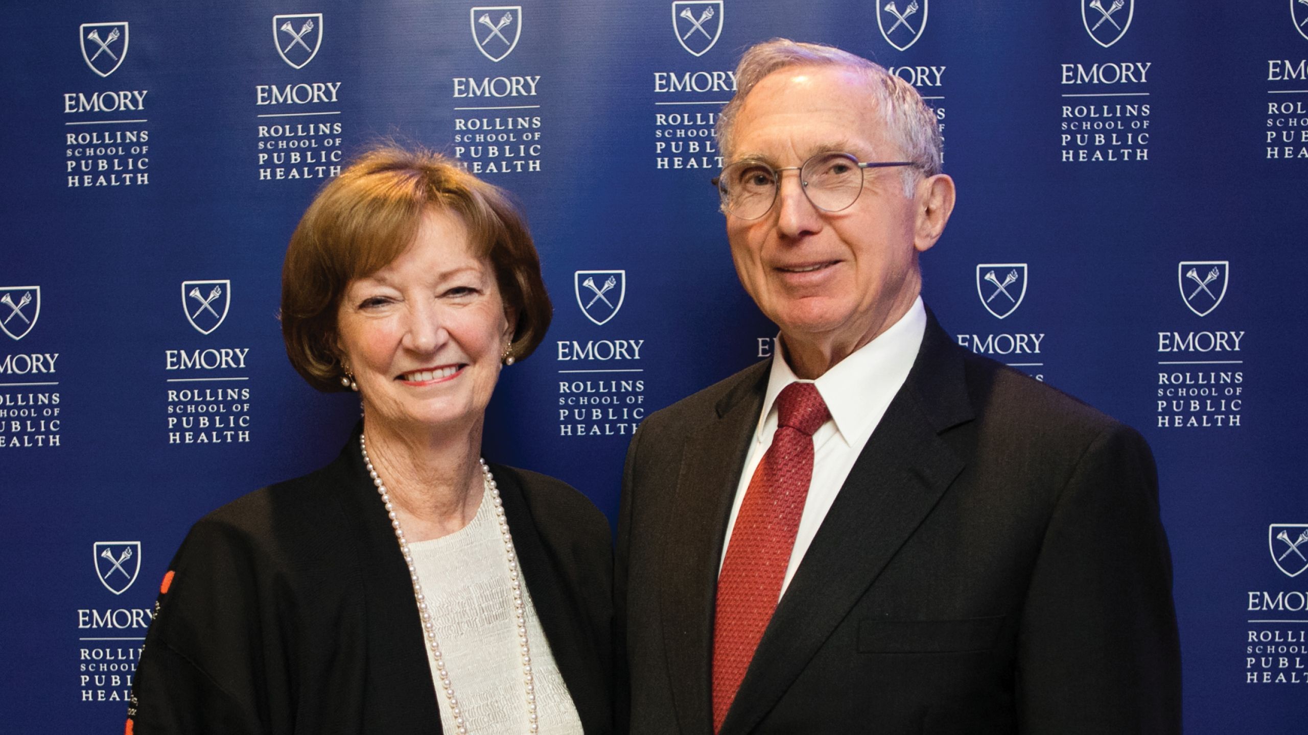 A woman and man pose