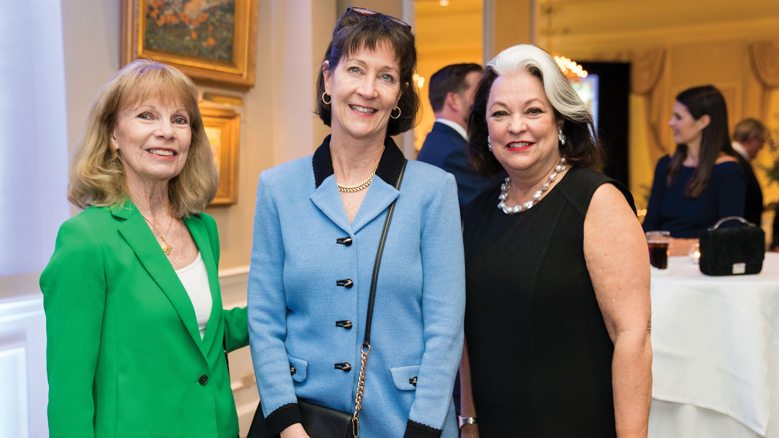 Three women pose together