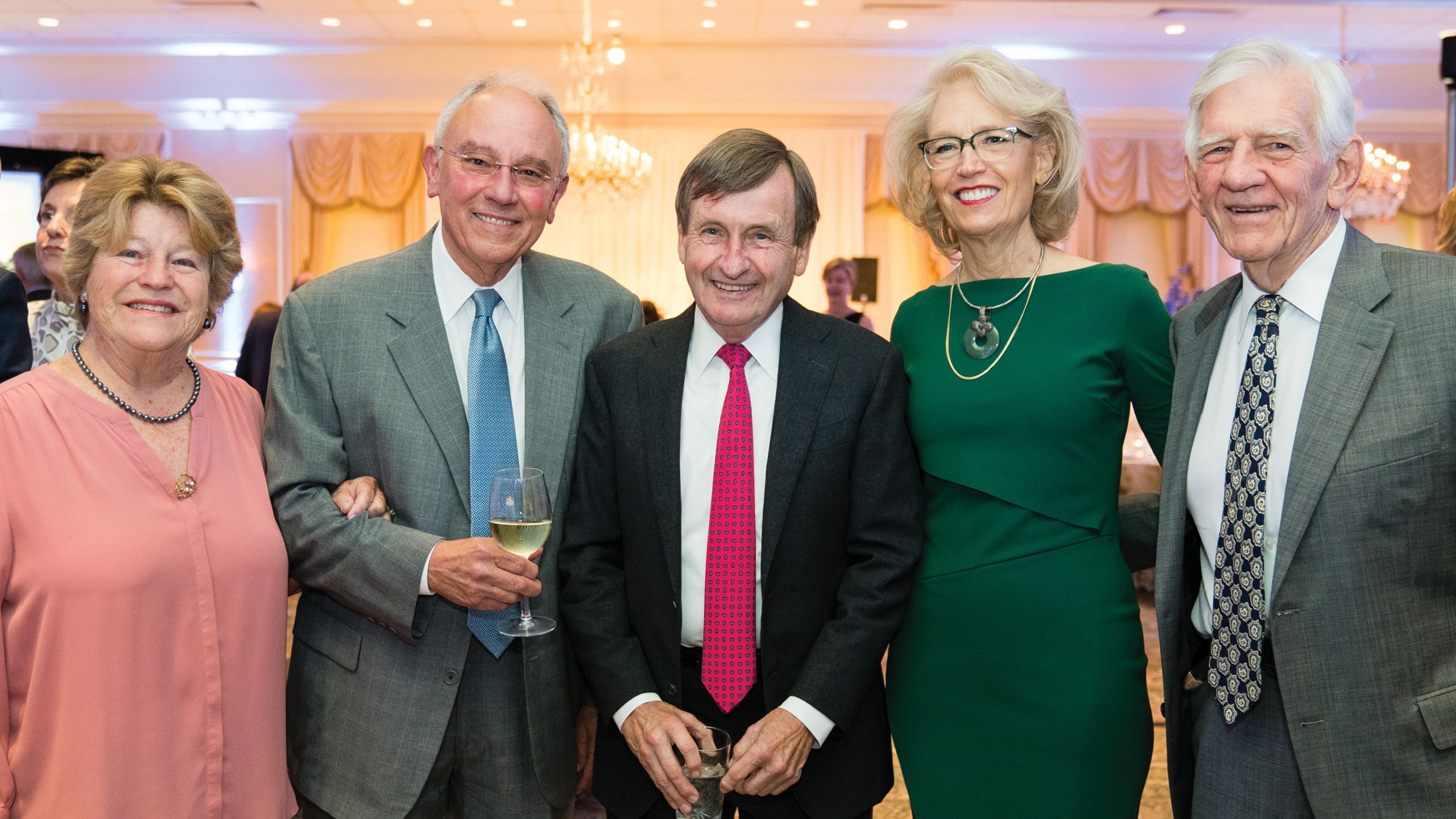 Two women and three men pose