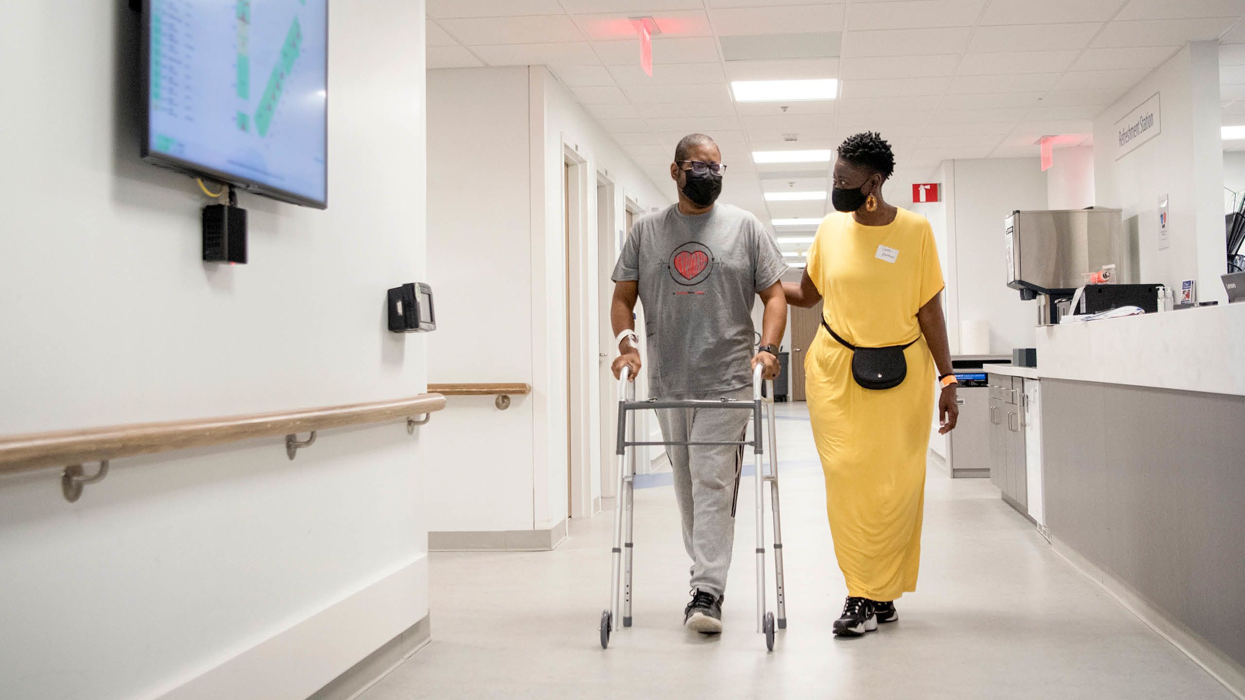 Tyronne Baldwin and his wife Edna walk down and Emory University Hospital hallway after Mr. Baldwin's heart transplant.