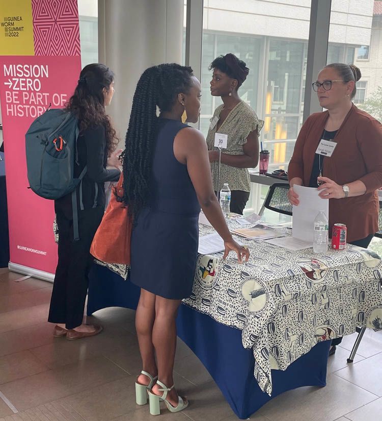 Mindze Mbala Nkanga and Sarah Yerian talking to students at the Rollins School of Public Health Career Fair