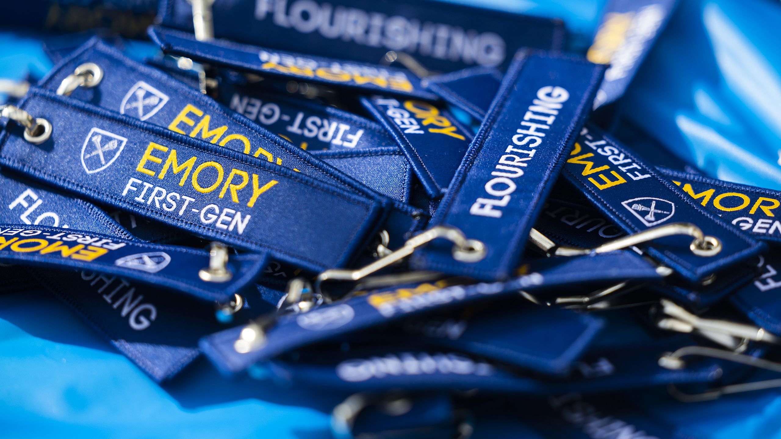 Key chains that read "Emory First-Gen" and "Flourishing"