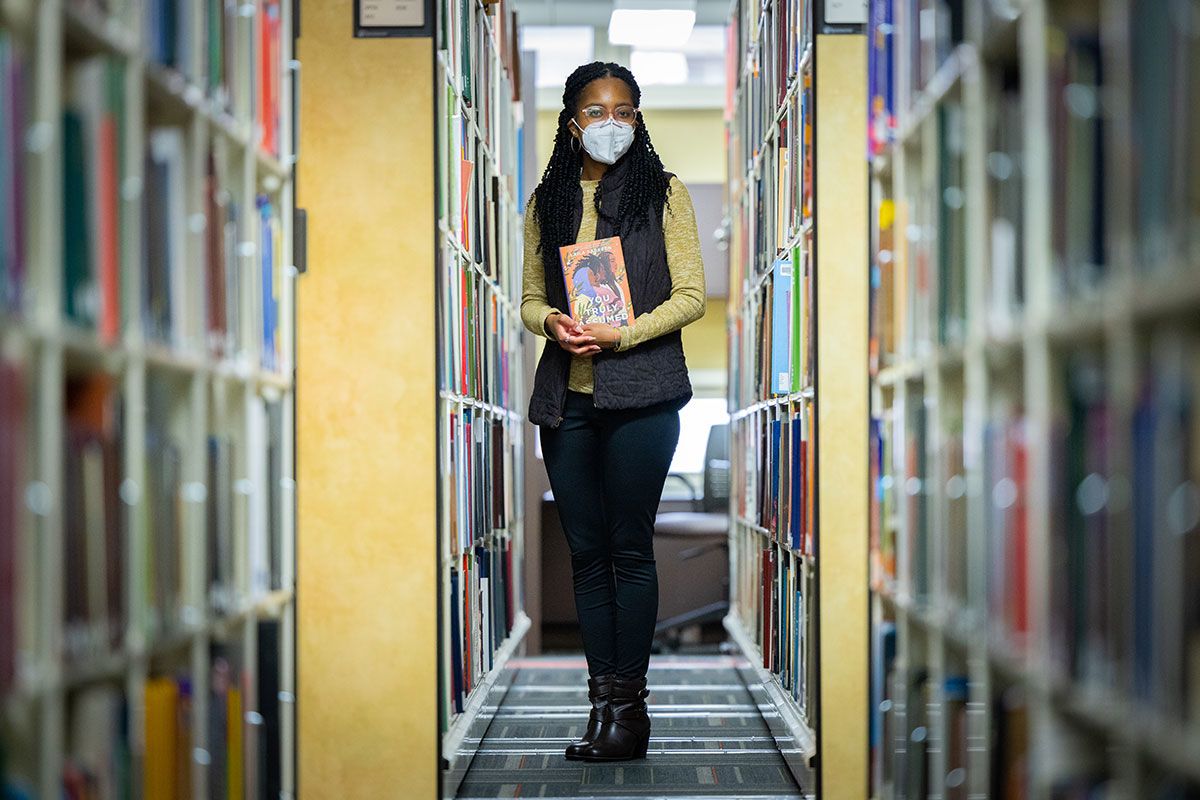 Laila Sabreen holds a copy of her book