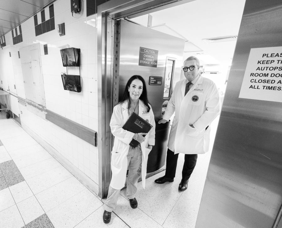 Photo of Michele Slone and Jason Graham at the doorway to an autopsy room.