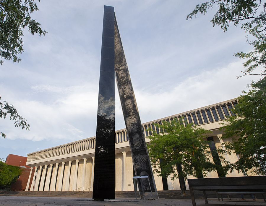 The public art installation "Double Sights," consisting of two beams, one showing positive images of President Wilson and one showing negative images