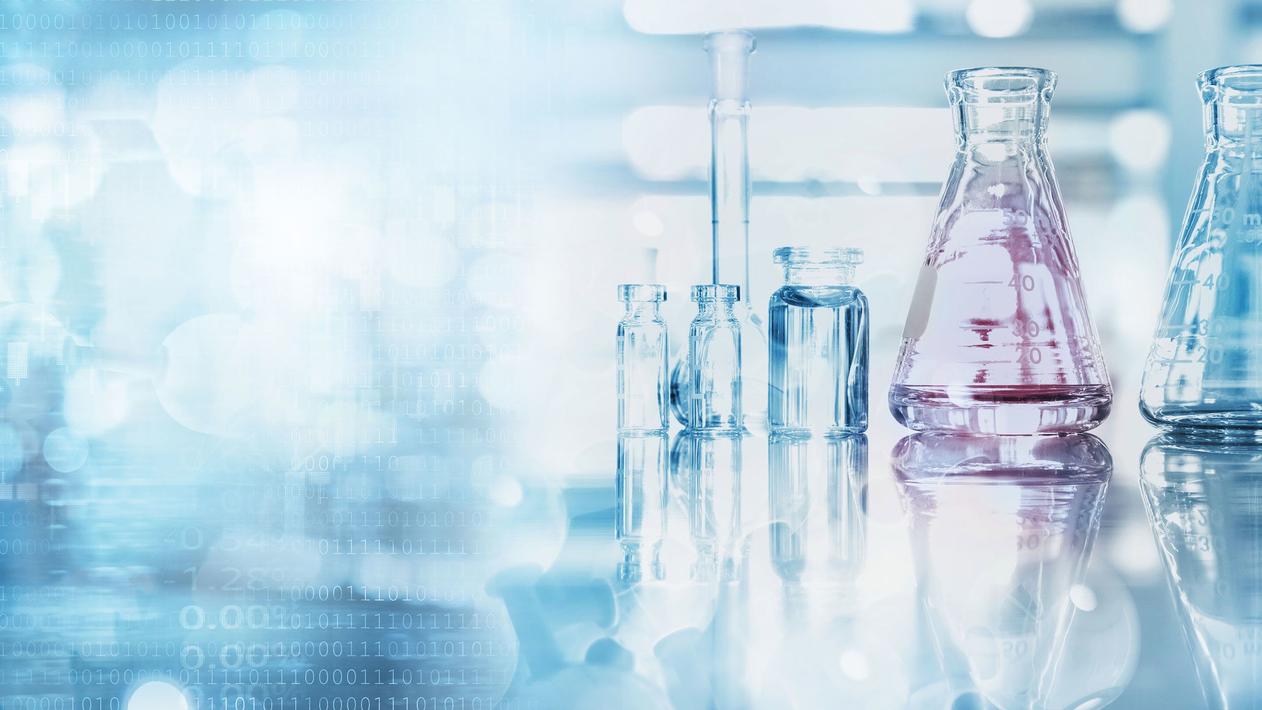 An illustration shows lab equipment and computer code