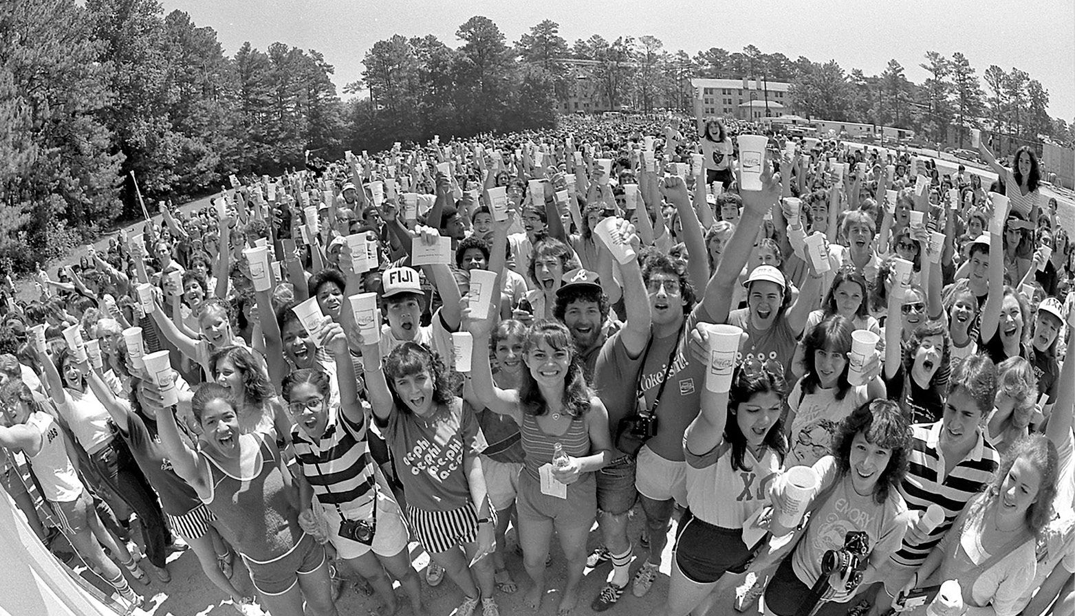 Photo of hundreds of Emory raising their cups in the first-ever Coke Toast