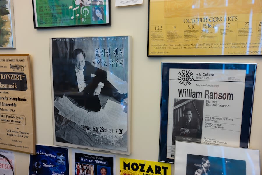 A close up image of multiple concert posters