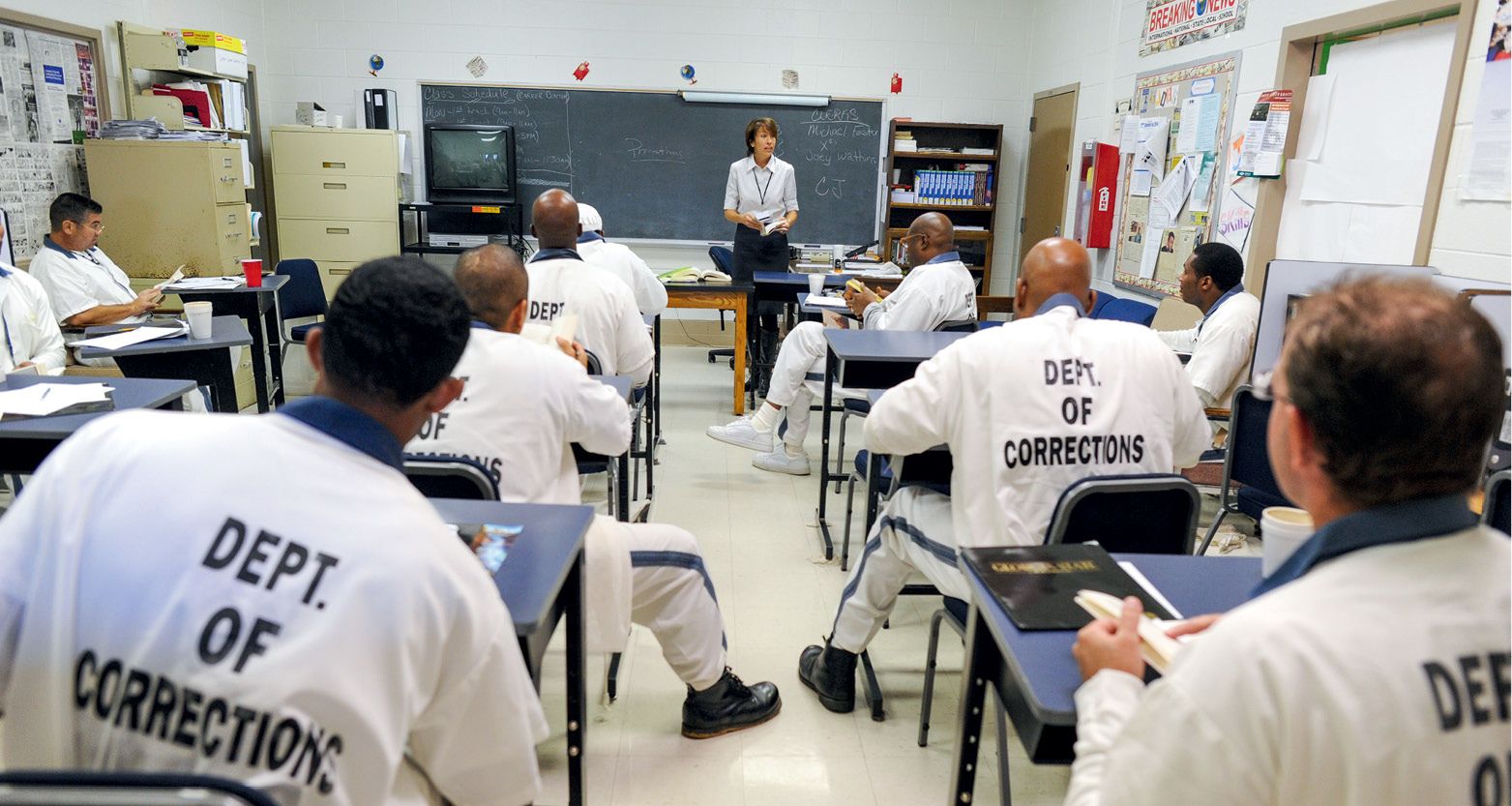 Photo of a prison classroom with incarcerated people being taught by Oxford College's Sarah Higinbotham