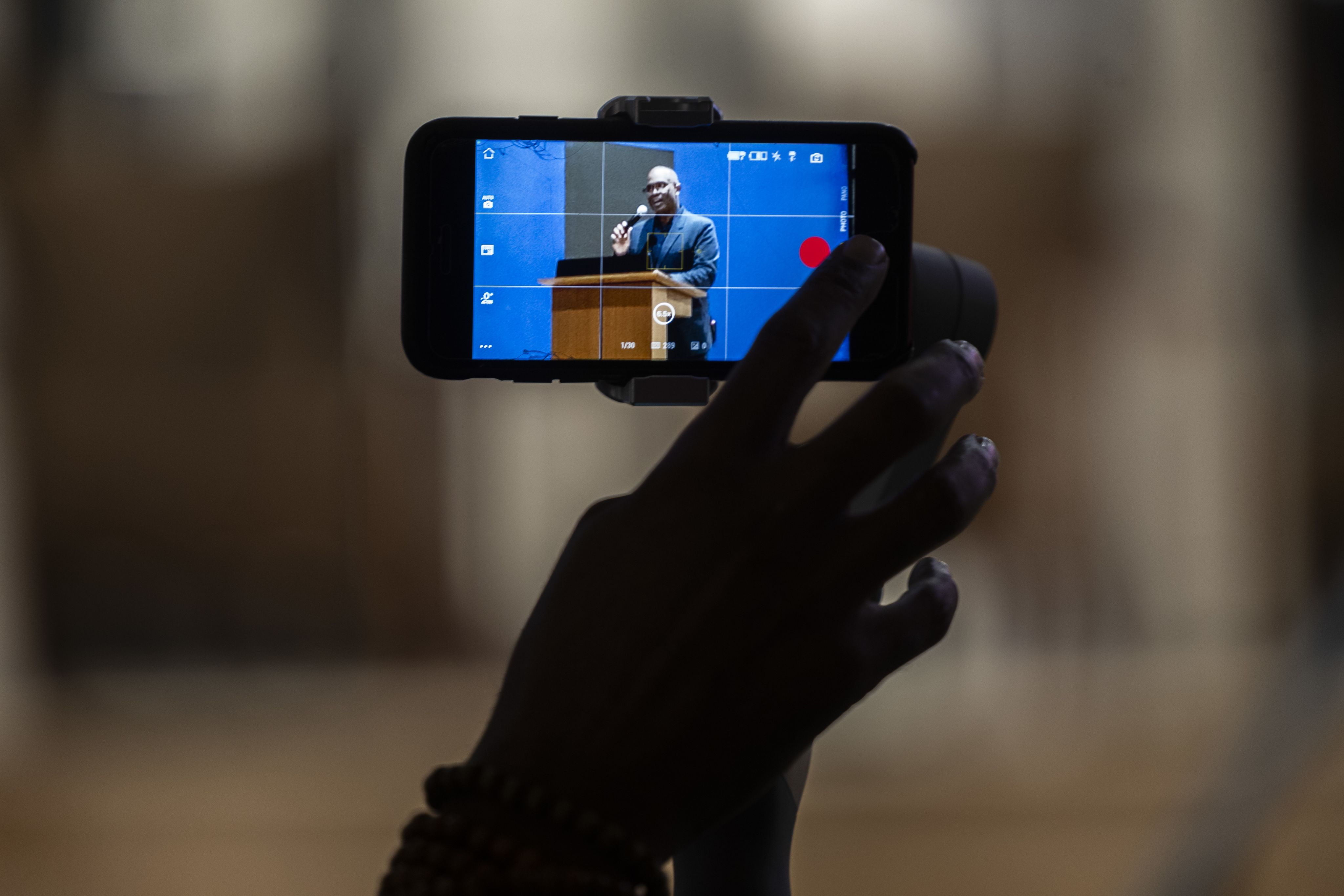Ken Carter speaking framed on phone camera