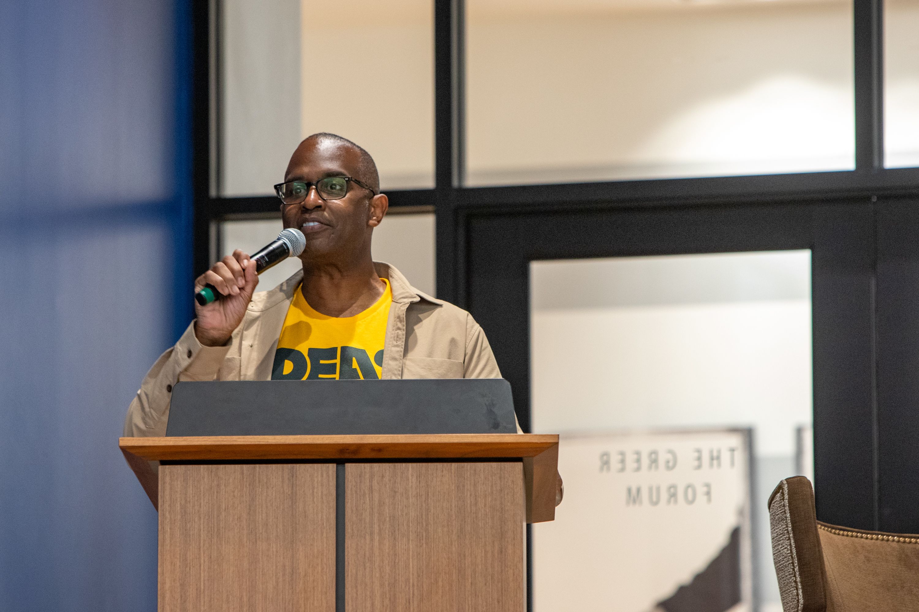 Kenneth Carter at podium with microphone